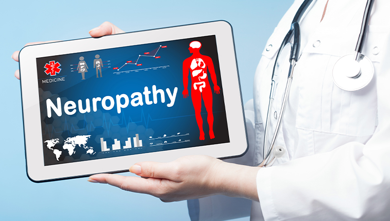 Doctor showing patient causes of peripheral neuropathy